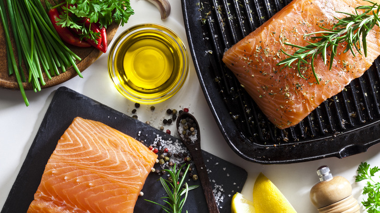 Raw salmon filets with herbs