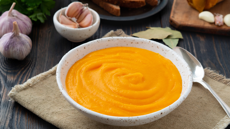 pureed carrots in white bowl