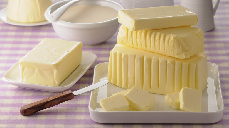 Blocks of butter on plates