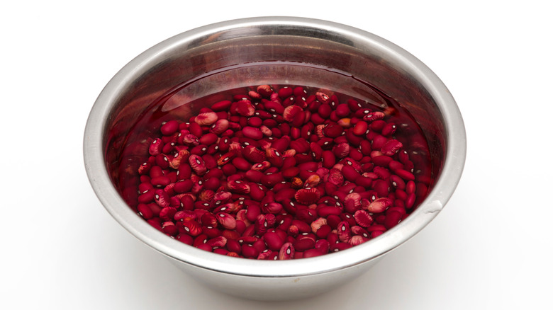 Soaking red kidney beans in metal bowl