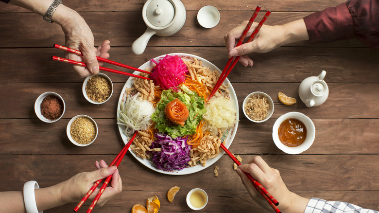 Serve food with chopsticks