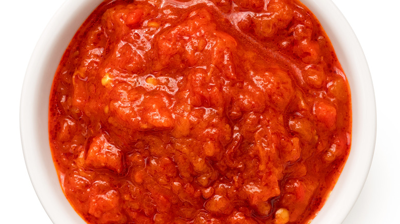 White bowl of tomato sauce