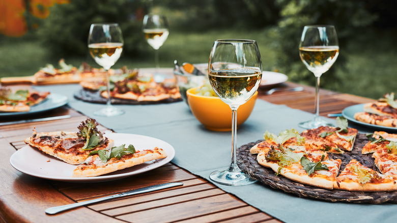 pizza with wine glasses