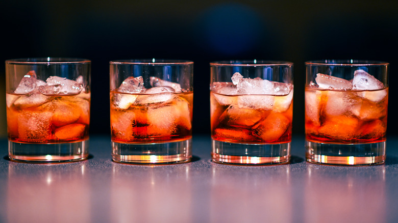 Four Negronis side by side