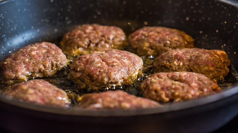 cooking burgers in pan