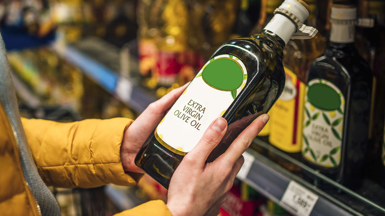 holding olive oil in store