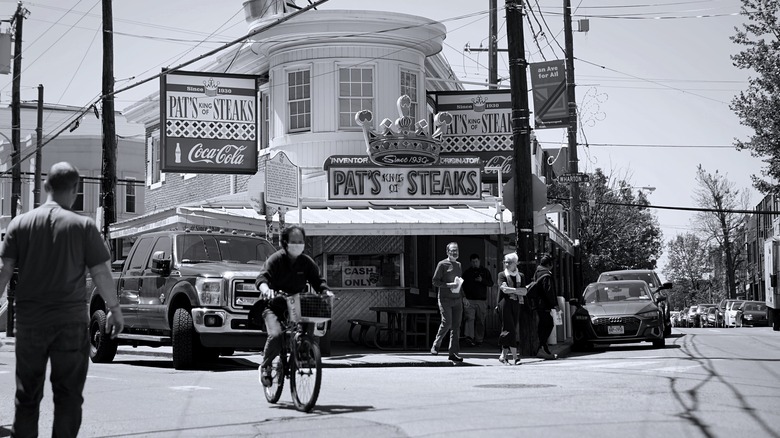 A black and white photo of Pat's King of Steaks