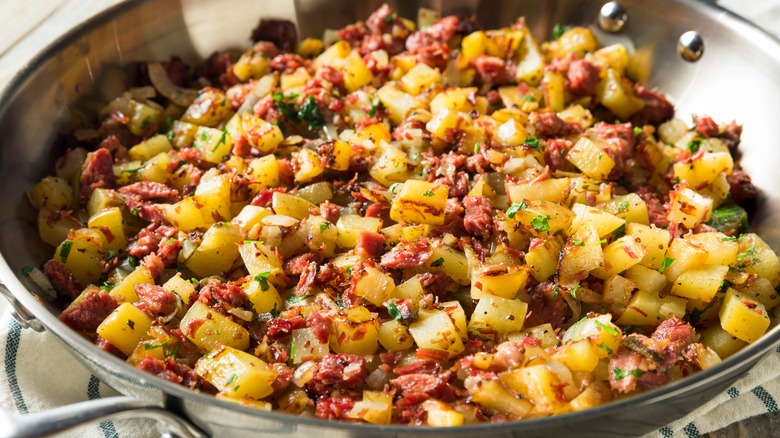 Diced breakfast potatoes with seasoning and veggies