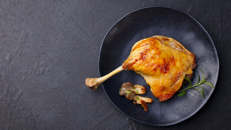 confit duck leg on a plate