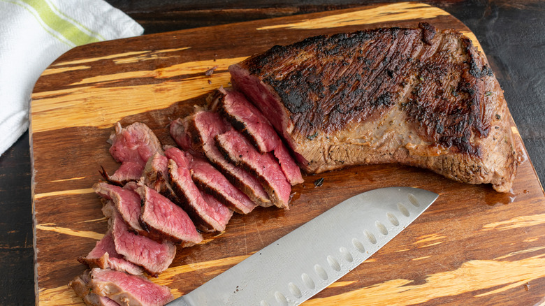 sliced tri-tip steak with knife