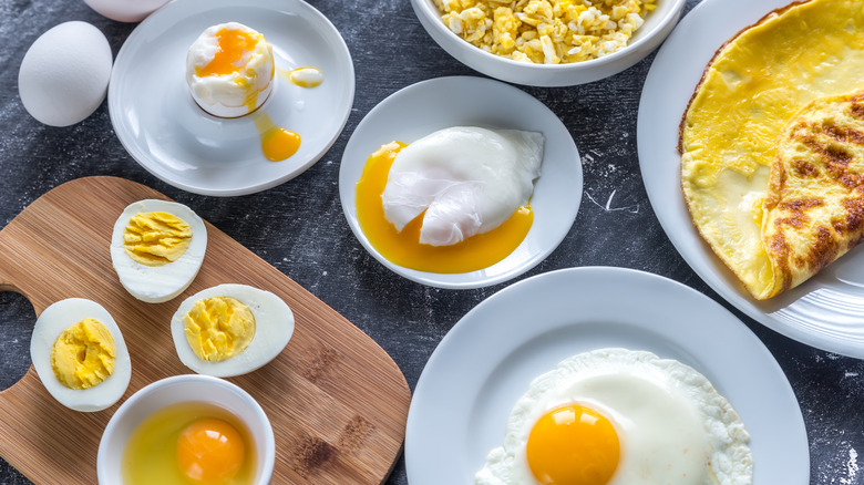 Various types of cooked eggs on dark background