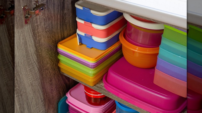 cupboard with empty storage containers