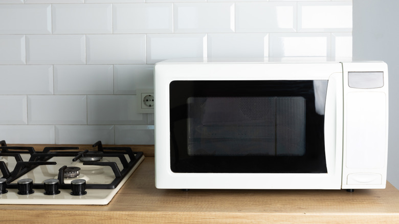 white microwave on countertop