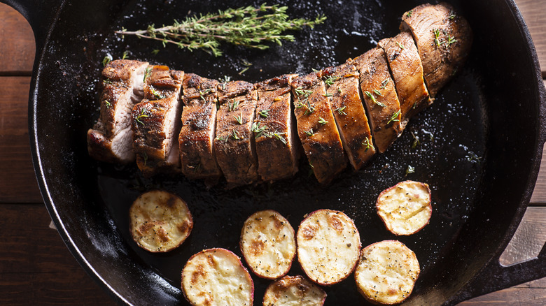 Pork tenderloin cooking in a pan