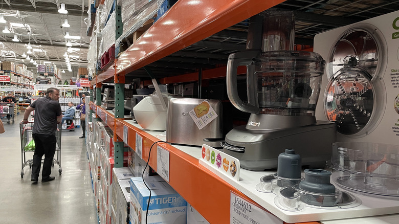 Costco shopper looks at items on shelf