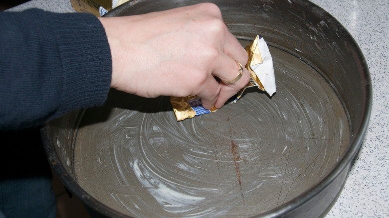 Greasing pan with butter wrapper