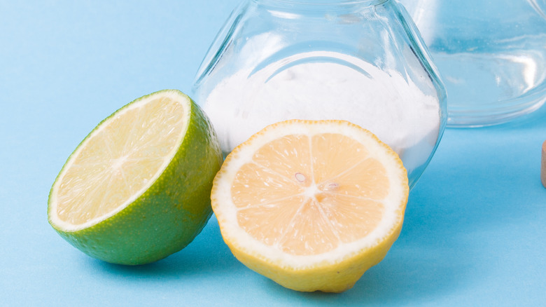 lime and lemon halves with glass jars