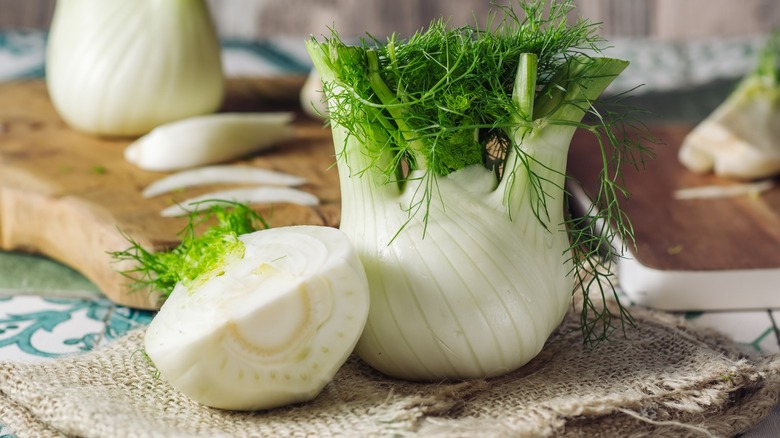 Fennel bulb cut in half with some stalk and frond remaining