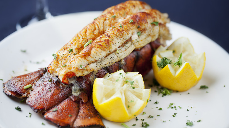 cooked lobster tail with lemons