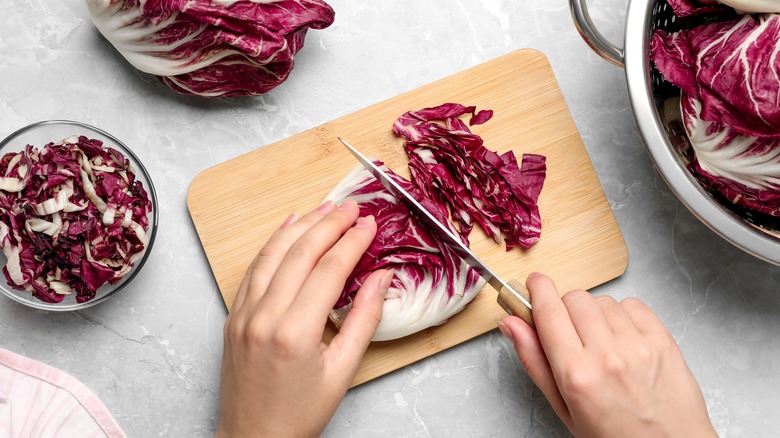 Woman cutting radicchio 