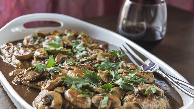 chicken marsala with a glass of wine