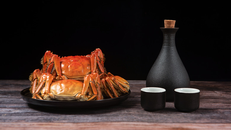 crabs with wine jug