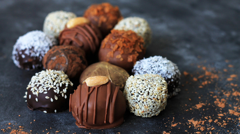 Gourmet chocolate truffles on slate.