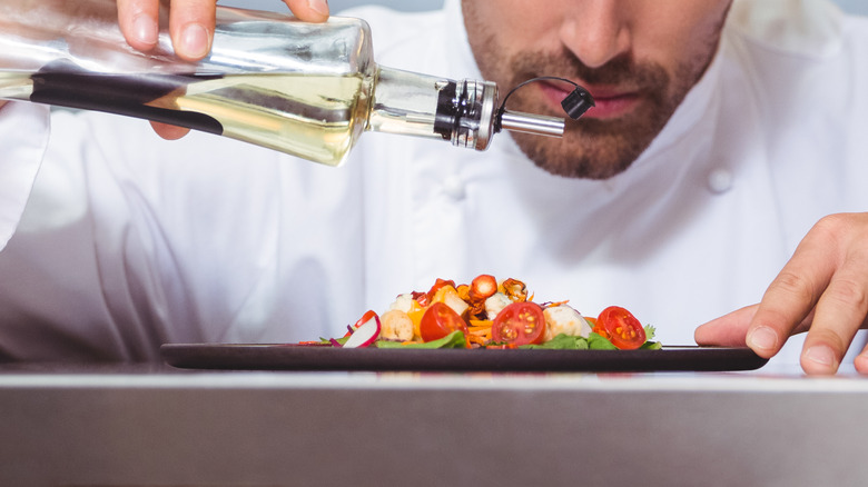 Chef using finishing oil