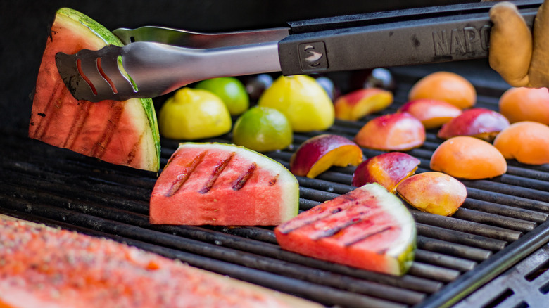 grilling fruit with tongs