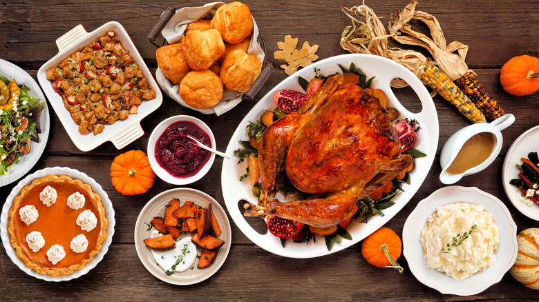 Thanksgiving dinner spread with turkey and sides