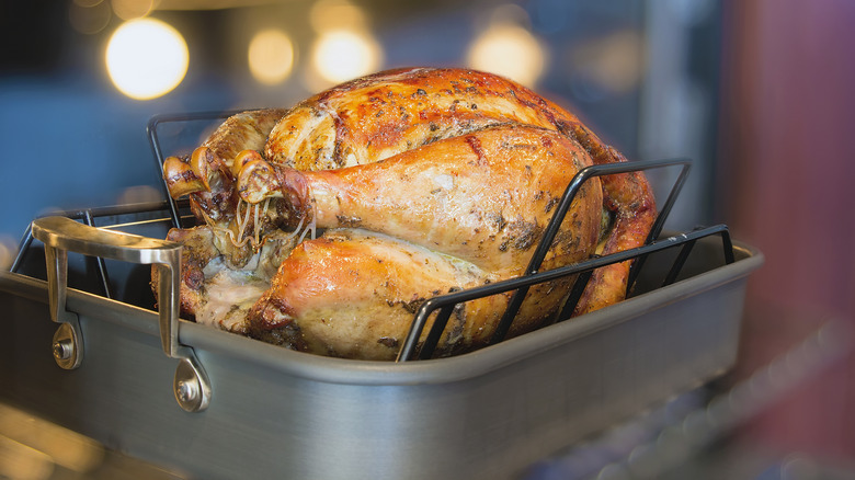 Chicken in roasting pan on rack