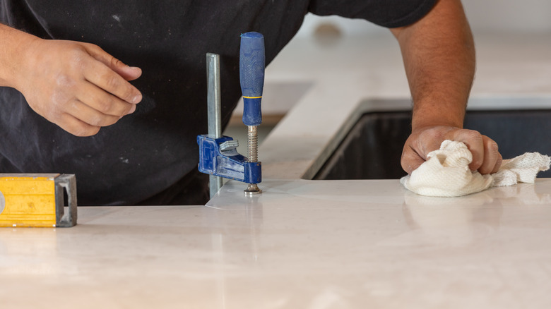 Workman installing marble counter