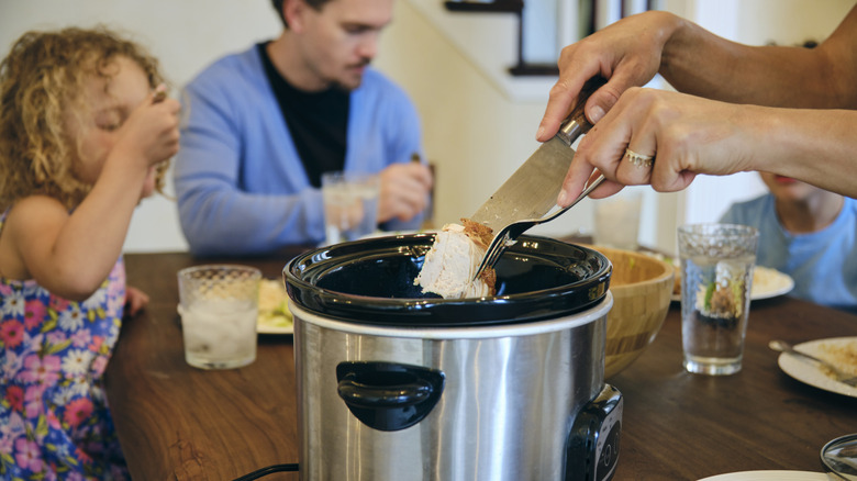 Family eating a slowcooker dinner