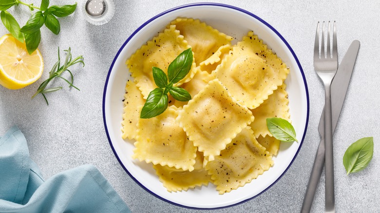 cooked ravioli with basil