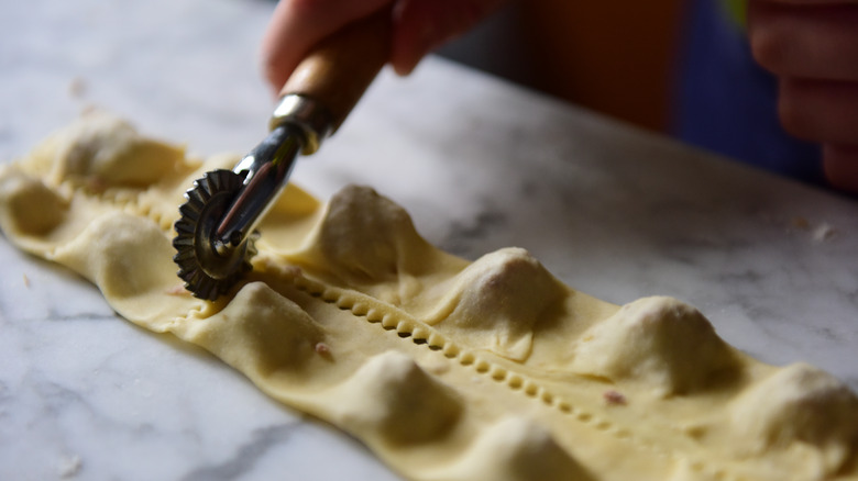 cutting ravioli pieces into shapes