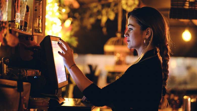 A server operates a point of sale system