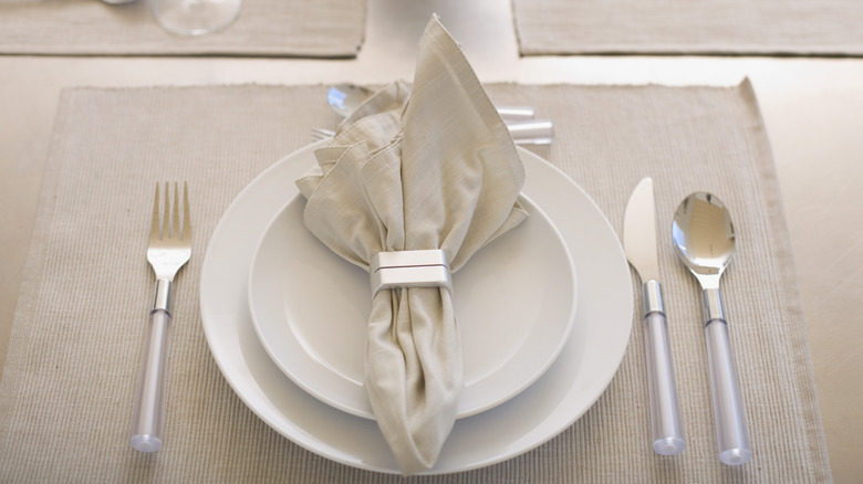 utensils around a dinner plate