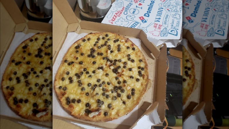 open pizza box with boba pizza inside