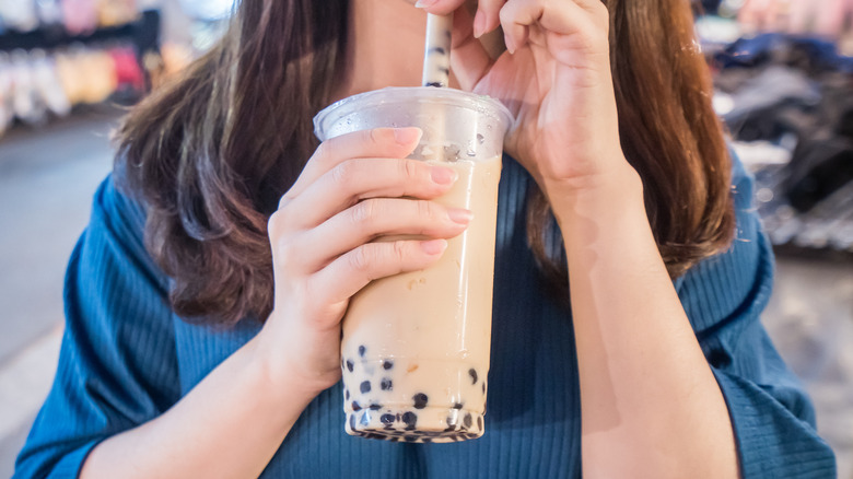 Woman drinking boba tea