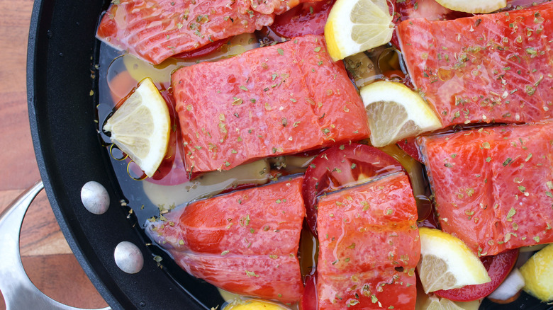 Poaching salmon in water 