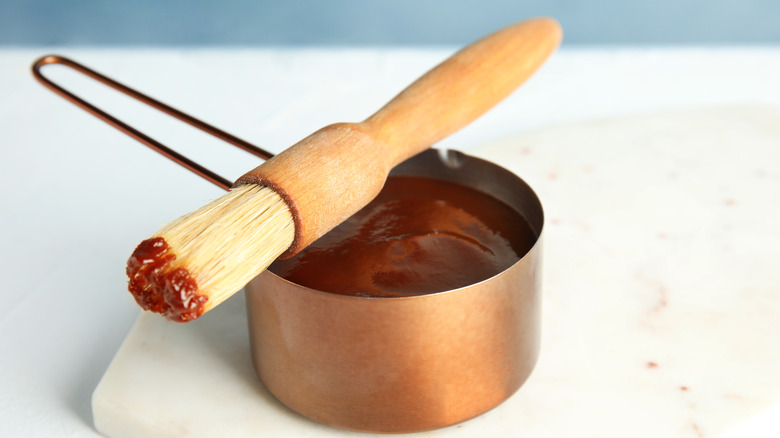 Measuring cup with BBQ sauce