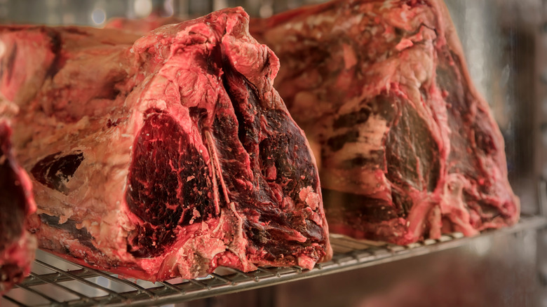 Raw tuscan steak on wire rack