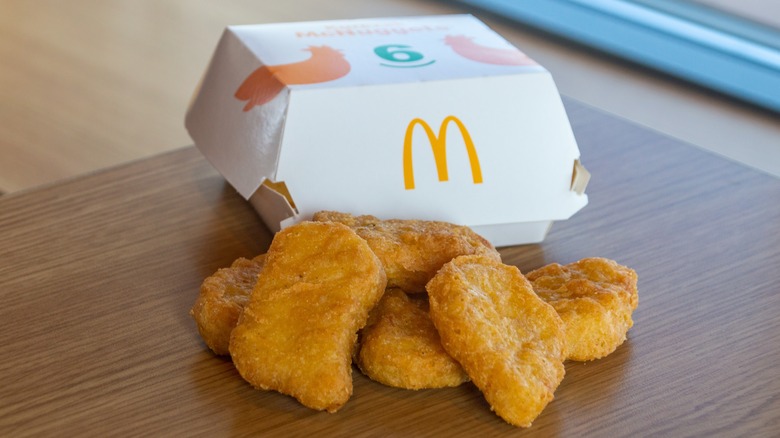 Chicken McNuggets wooden table with cardboard box