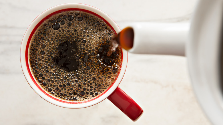 Coffee being poured into mug