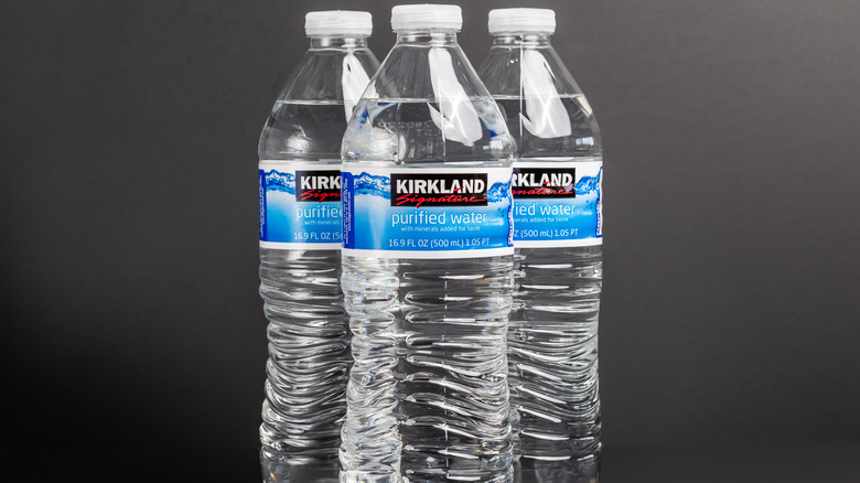 three Kirkland Signature water bottles