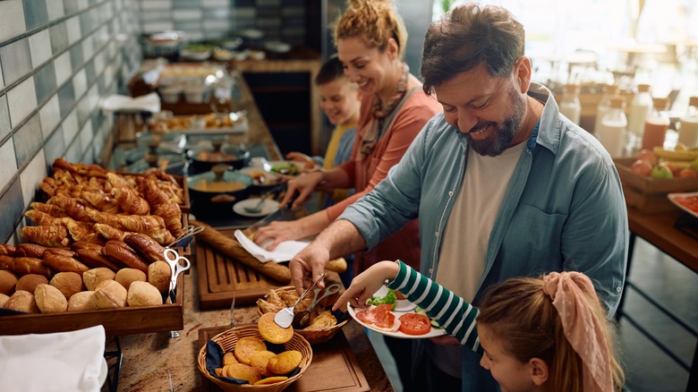 family at breakfast buffet