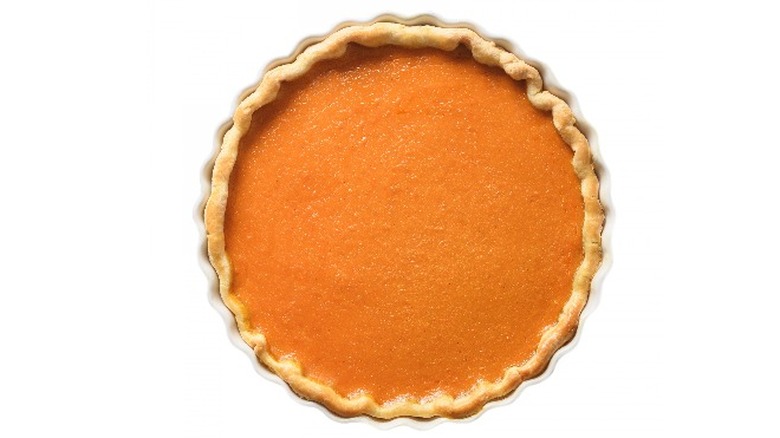 Pumpkin pie on white background