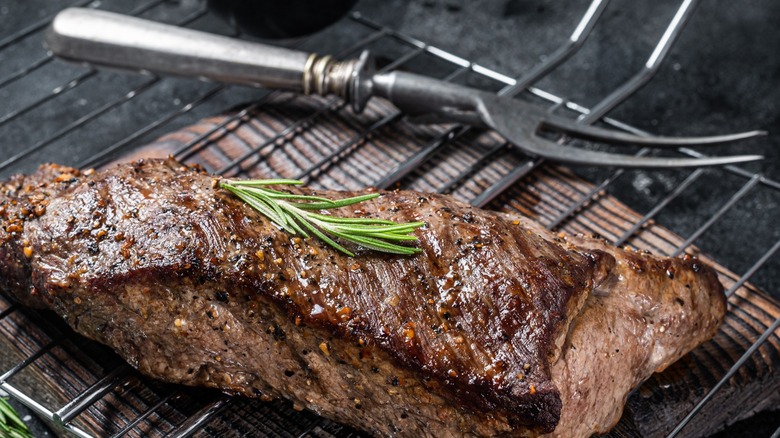 tri-tip steak on a grill grate