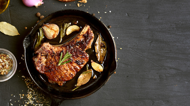 Pork chop in frying pan 