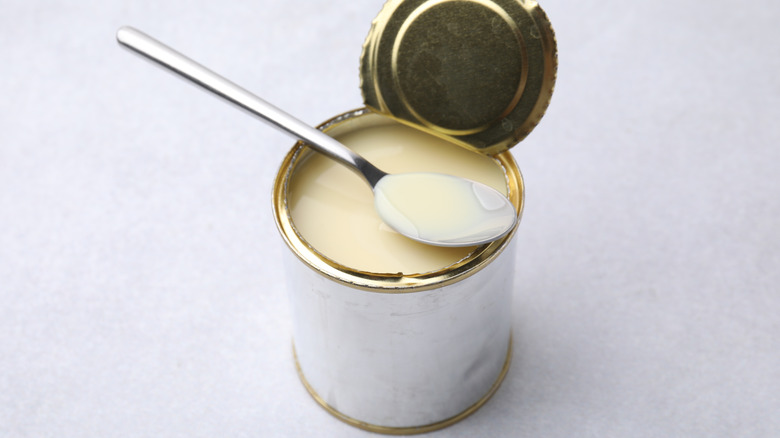 canned evaporated milk with spoon